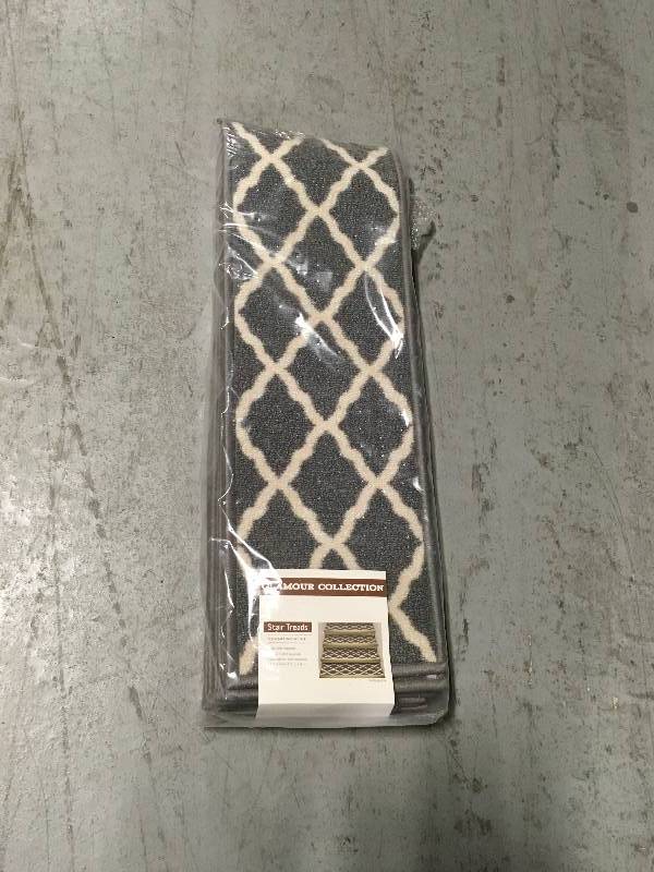 lot 30 image: OTTOMANSON PNK7023-13PK GLAMOUR COLLECTION TRELLIS DESIGN STAIR TREAD, 8.5 X 26, GRAY not used