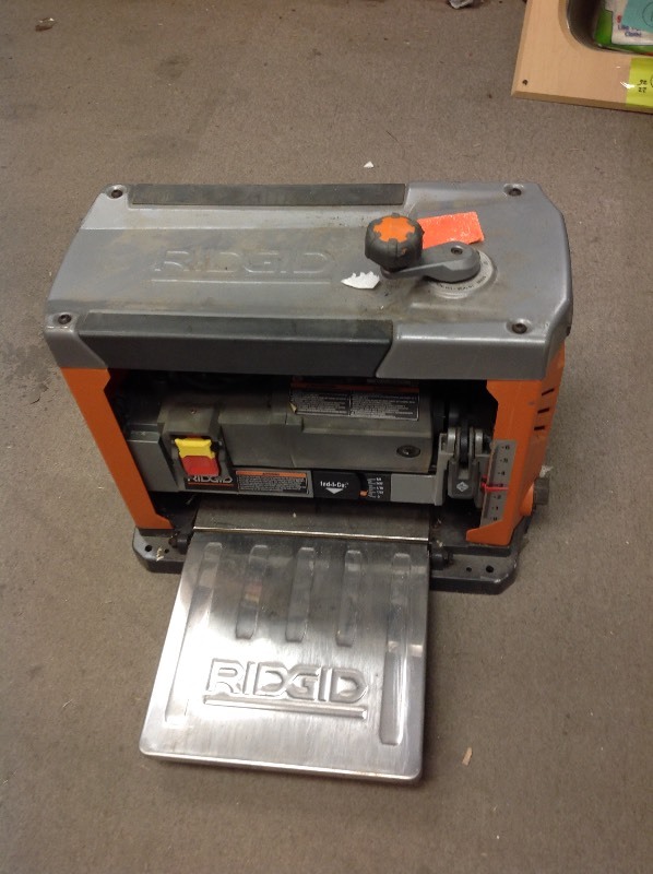 lot 106 image: RIDGID 13 in. Thickness Corded Planer used in working conditions