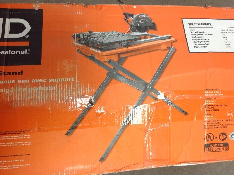 lot 109 image: RIDGID 7 in. Tile Saw with Stand   in like new good condition