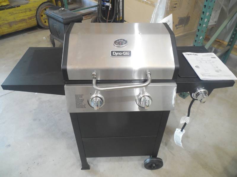 lot 64 image: Dyna-Glo 2-Burner Open Cart Propane Gas Grill in Stainless Steel and Black with Side Burner