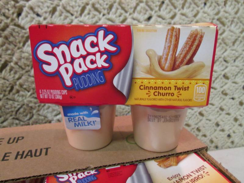 lot 157 image: Case of 12 4-Pack Cups of Cinnamon ...