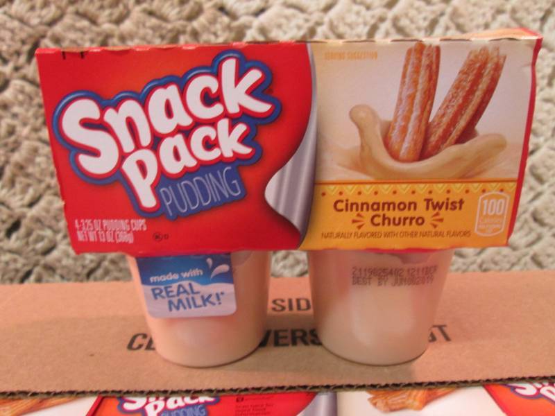 lot 204 image: Case of 12 4-Pack Cups of Cinnamon ...