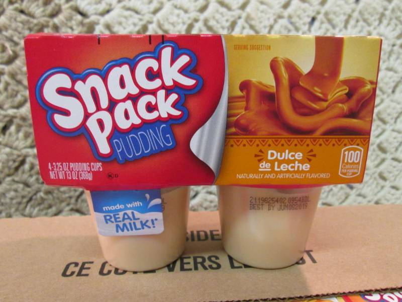 lot 205 image: Case of 12 4-Pack Cups of Dulce de ...