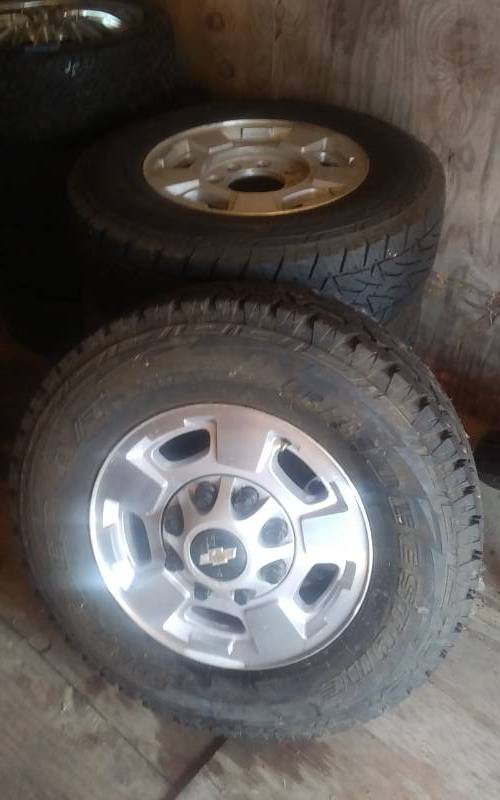 lot 28 image: Set Of 4-Chevrolet Truck Trims (8-Bolt) With Tires)