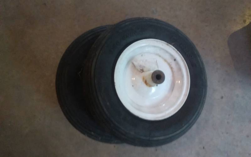 lot 87 image: Pair Of Wheel Barrow Wheels 80-8