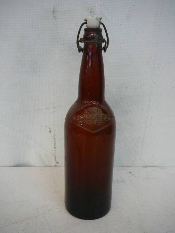 lot 143 image: Antique 12 Gain Belt Bottle