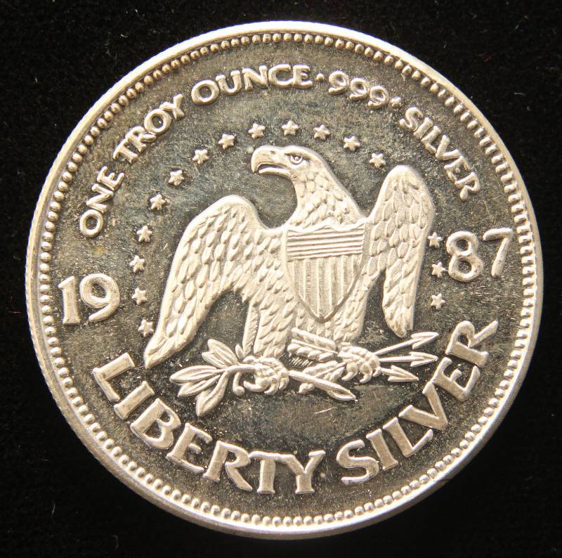 lot 16 image: 1 TROY OZ. .999 FINE SILVER 1987 A-MARK LIBERTY