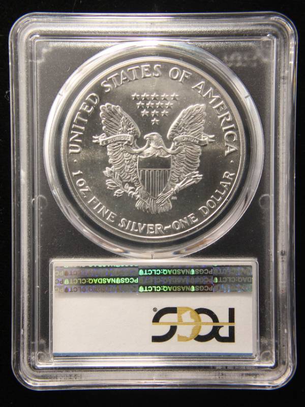 lot 34 image: 1989 AMERICAN SILVER EAGLE 1 TROY OZ. .999 FINE SILVER MS69 PCGS