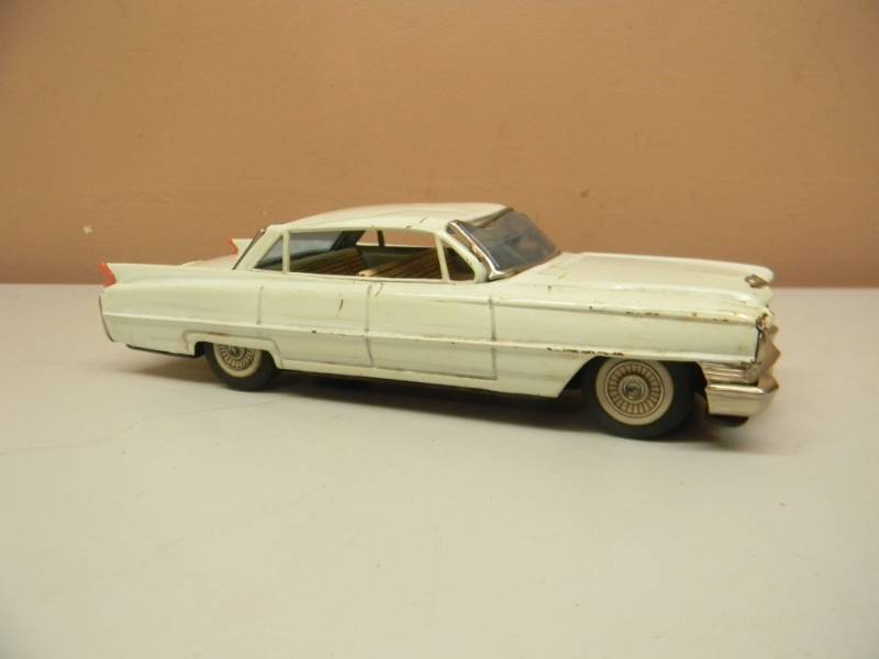 lot 72 image: VINTAGE - Made In Japan Tin Litho Sign Of Quality Cadillac Friction Toy - RARE - SEE PICTURES