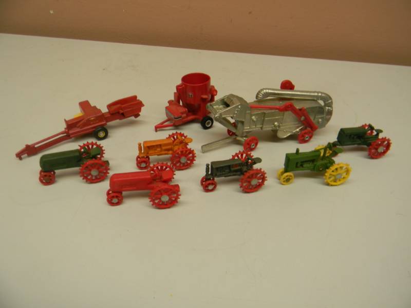 lot 106 image: VERY RARE - JLE DIE CAST SUMMER TOY FEST FARM IMPLEMENT - WITH 6 RARE PLASTIC MINI TRACTORS & 2 DIE CAST FARM IMPLEMENTS - NICE COLLECTION - SEE PICTURES