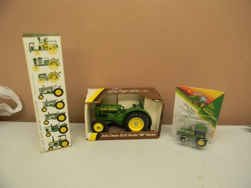 eight john deere miniature toy tractors