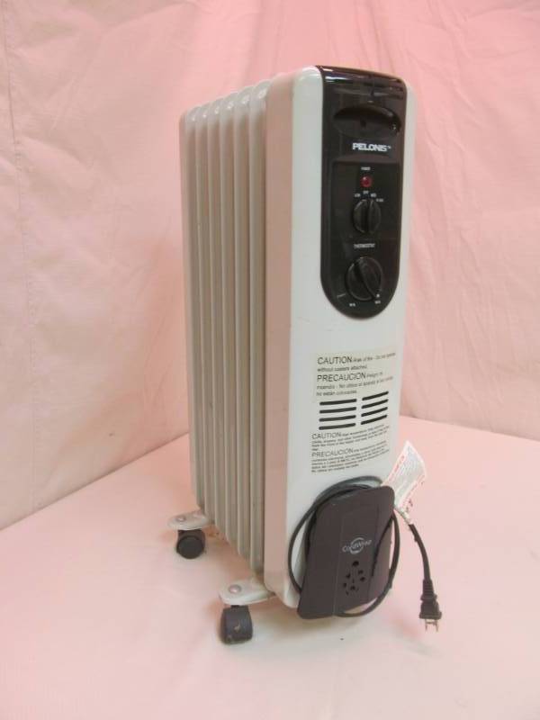 lot 34 image: Oil filled portable heater...