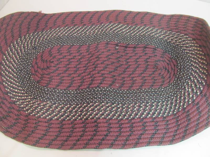 lot 60 image: Oval braided rug- 30x48...