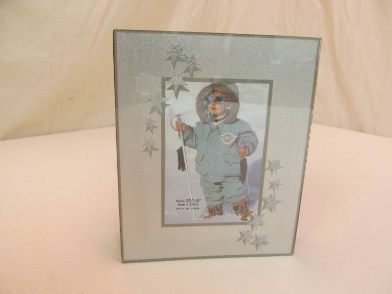 lot 96 image: Silver star 5x5 photo album (36)...