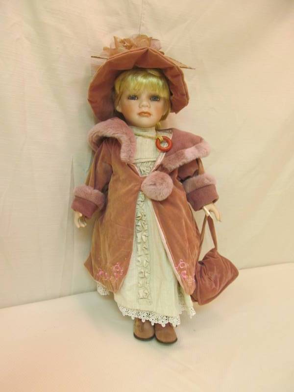 lot 127 image: Porcelain Doll...