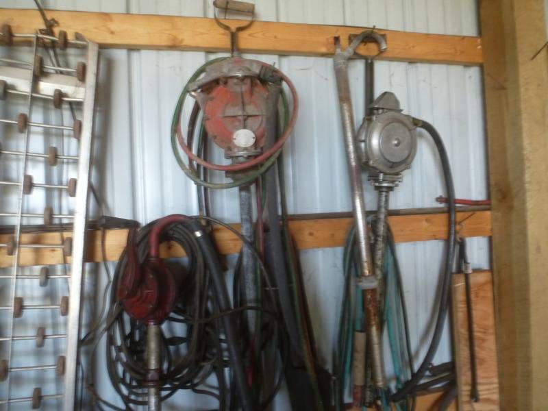 lot 46 image: Wall of Tools & Oil Pumps