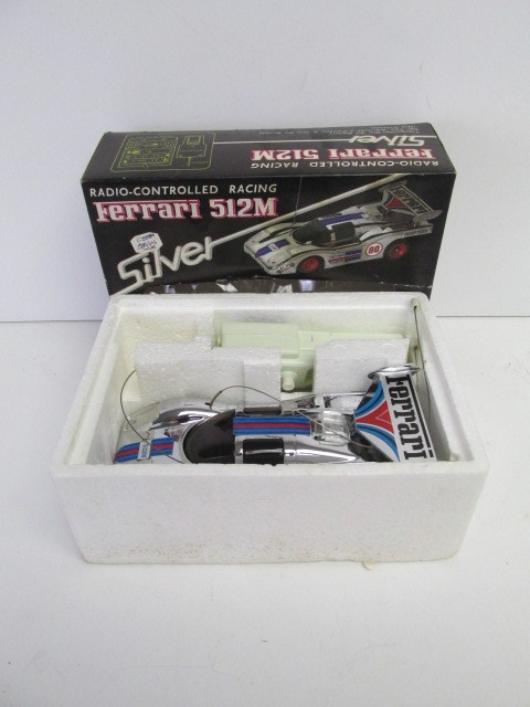 lot 34 image: MINT IN BOX Unused Vintage FERRARI 512M Radio Controlled Race Car