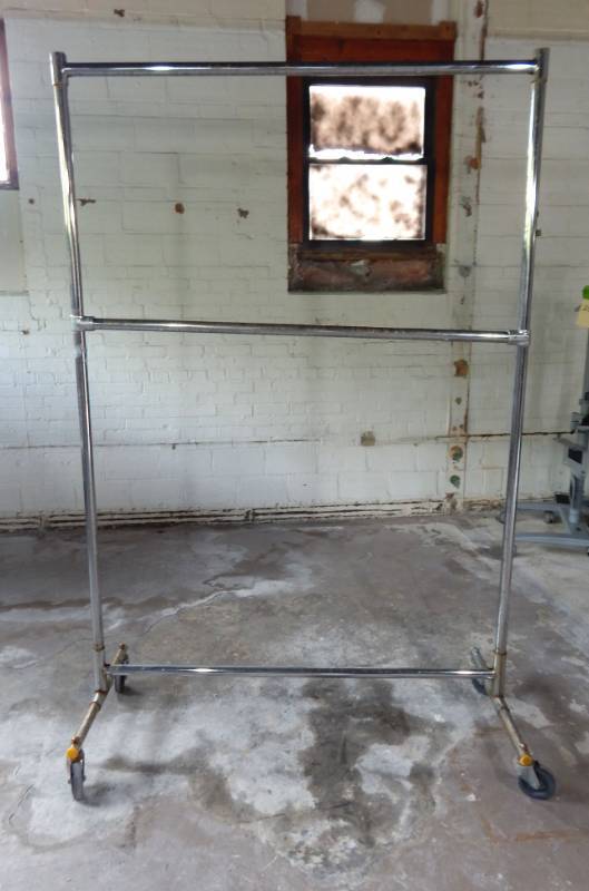 lot 60 image: Large Rolling Clothing Rack with Adjustable Bar