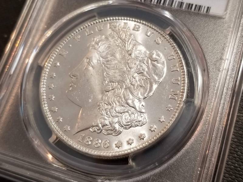 lot 02 image: 1886 MORGAN SILVER DOLLAR MS64 PCGS