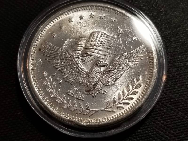 lot 19 image: 1 TROY OZ. .999 FINE SILVER EAGLE WITH FLAG IN AIRTITE