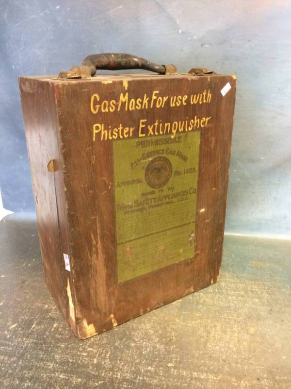 lot 53 image: Vintage Projector in a Wooden Gas Mask Box