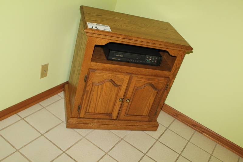 lot 18 image: Swivel Top Wood Entertainment Center