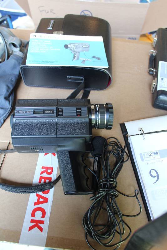 lot 10 image: Bell&Howell Filmsonic XL Zoom Movie Camera with Case, Instruction Manual