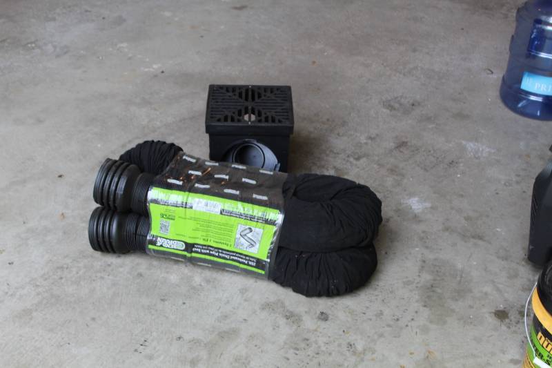 lot 57 image: Drain Tile with 25ft. Perforated Drain Tube, 9in. Black Catch Basin Kit