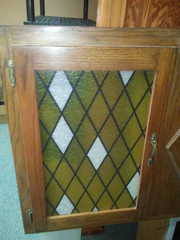lot 19 image: Two upper cabinets - Gothic stained glass look doors.