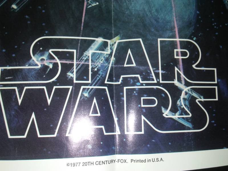 lot 31 image: Rare Star Wars original soundtrack with the poster