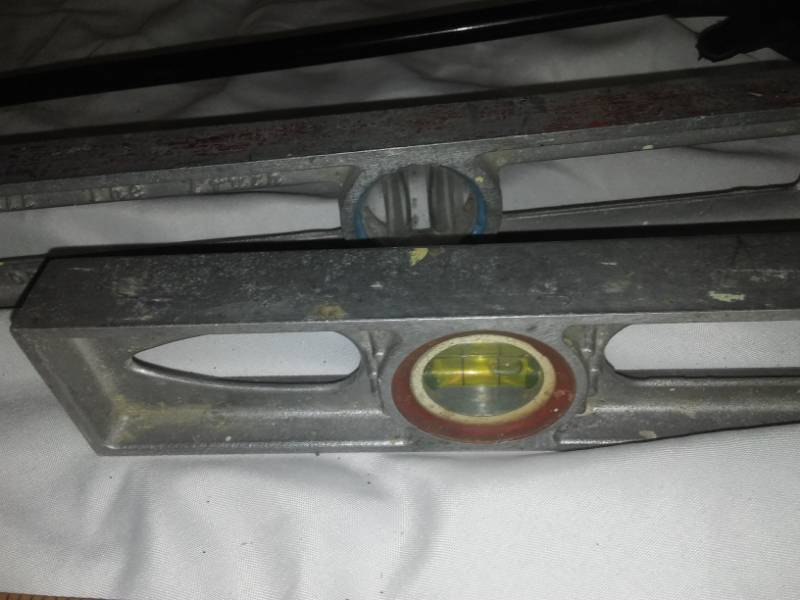 lot 65 image: Metal levels, yardsticks, Grabber tool.