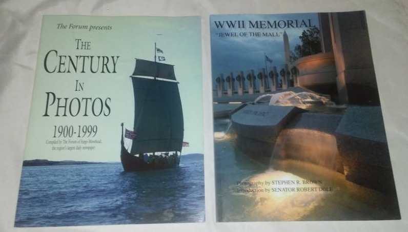 lot 81 image: Two books - World War II war memorial book and One Hundred Years of Fargo forum.