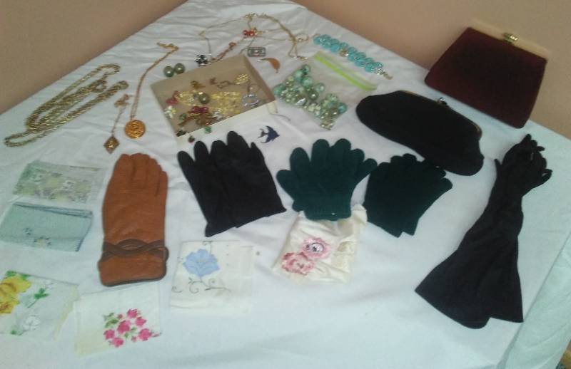 lot 99 image: Jewelry, gloves and vintage clutch purses.