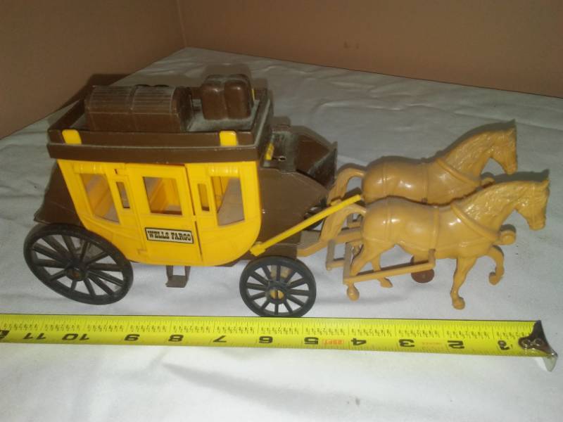 lot 141 image: Wells Fargo Stagecoach toy,
