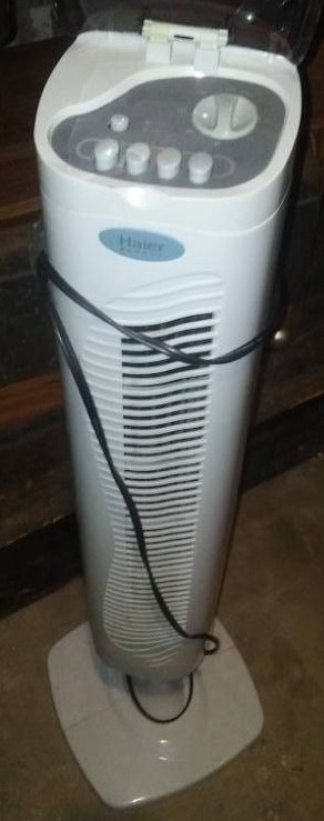 lot 220 image: Haier tall heater and fan. Like new
