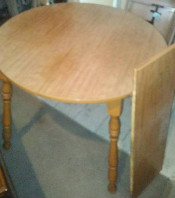 lot 236 image: Kitchen table with Leaf. Wood frame, laminate top,