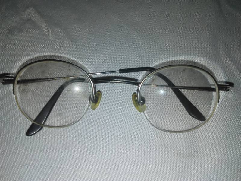 lot 266 image: John Lennon-style glasses. Foreyes eyes case