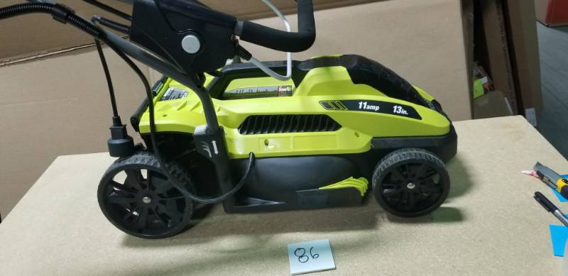 lot 86 image: RYOBI 13 in. 11 Amp Corded Electric Walk Behind Push Mower in good condition