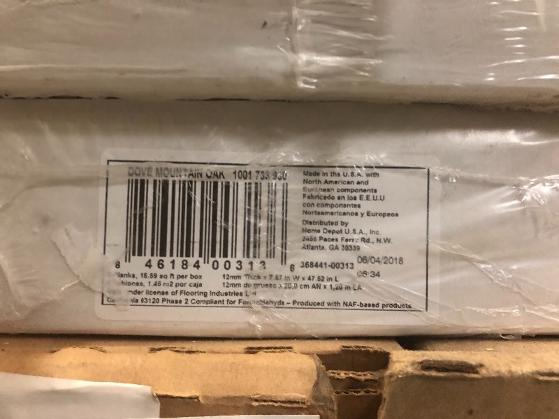 lot 114 image: Lot of 7 cases of Home Decorators Collection Dove Mountain Oak 12 mm Thick x 7-78 in. Wide x 47-1732 in. Length Laminate Flooring (15.59 sq. ft.  case)