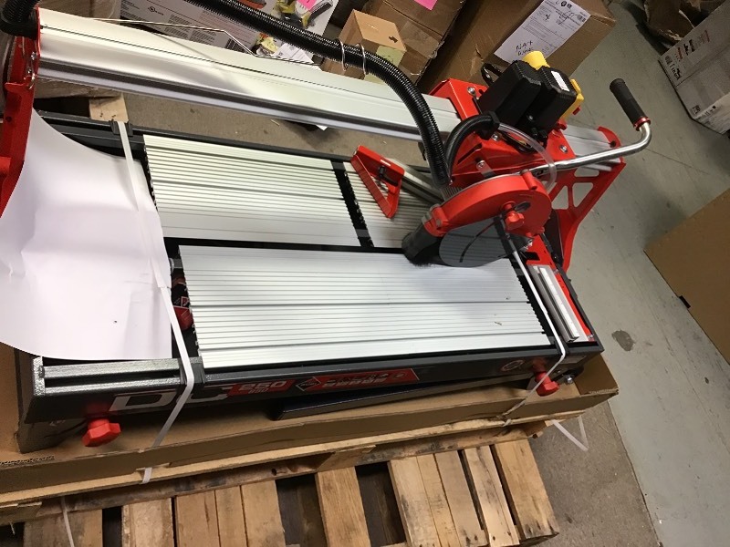 lot 101 image: Rubi 10 in. 120-Volt Tile Saw DC 38 in. not used