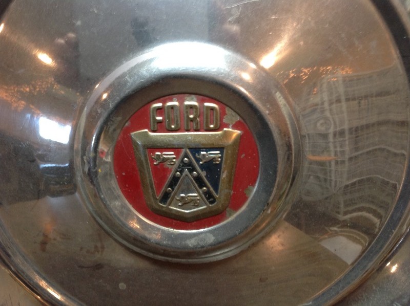 lot 38 image: Pair of Ford Hubcaps