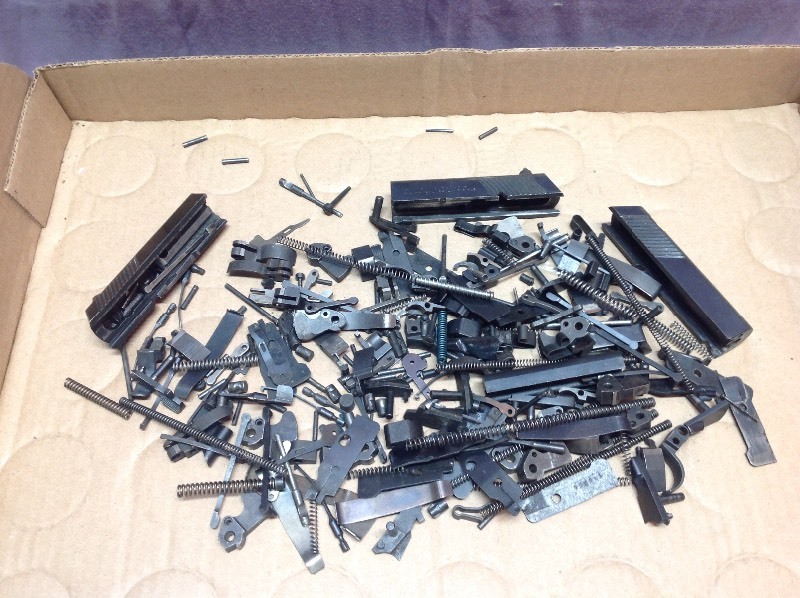 lot 66 image: Colt Woodsman 22 Cal Parts