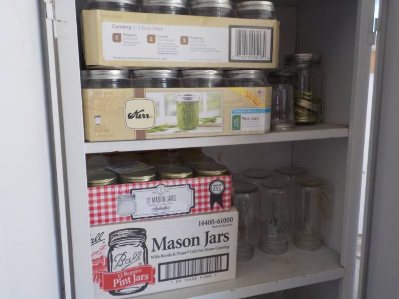 2 Shelves of Canning Supplies cabi...