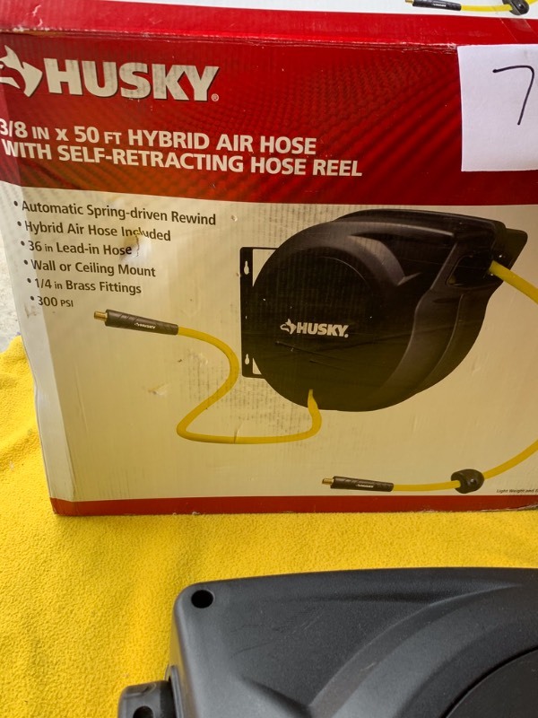 lot 73 image: 38 50 foot Hybrid Air Hose with Self retracting reel