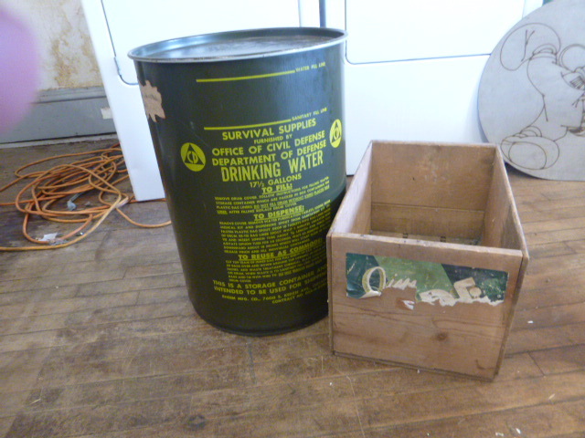 17 12 Gallon Drum and Wooden Crate