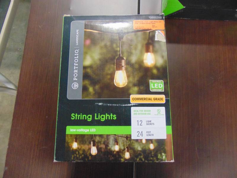 lot 403 image: Portfolio 24-ft 12-Light White LED Plug-in Bulbs String Lights SLL12BK