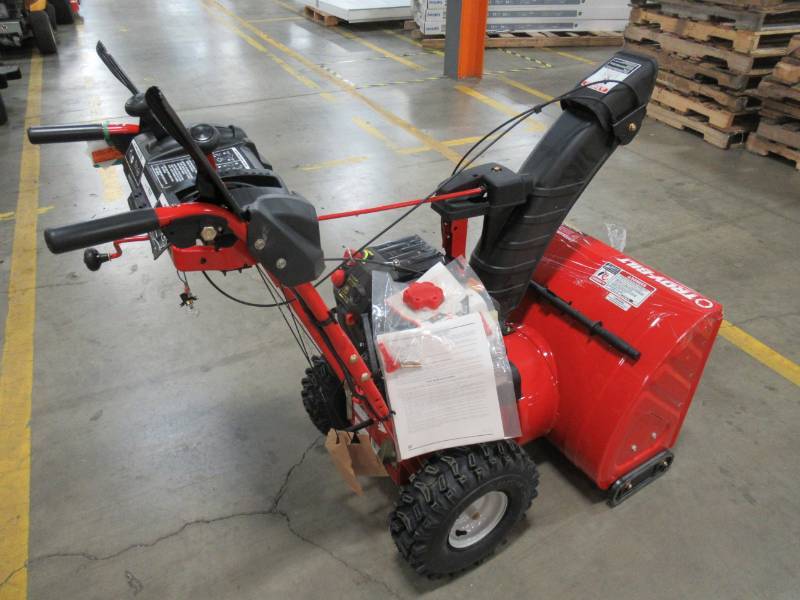 lot 9 image: Troy-Bilt 26 in. 243 cc 2-Stage Gas Snow Blower with Electric Start Self Propelled and 1-Hand Operation - Cracked Control Dash bent handle bars - NEVER RUN