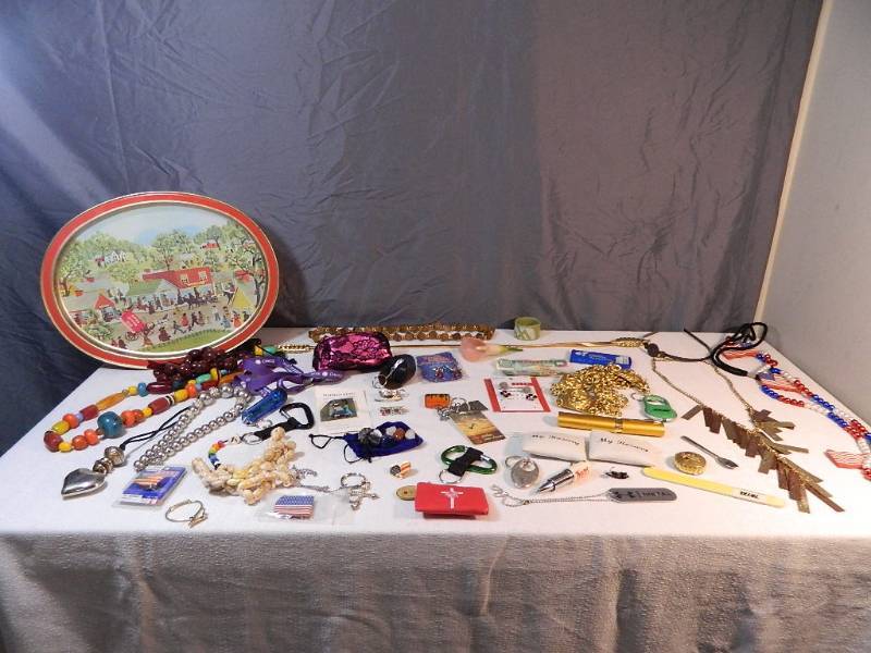lot 22 image: Assorted Jewelry, Foreign Currency, Stones, and Collectibles in Tin