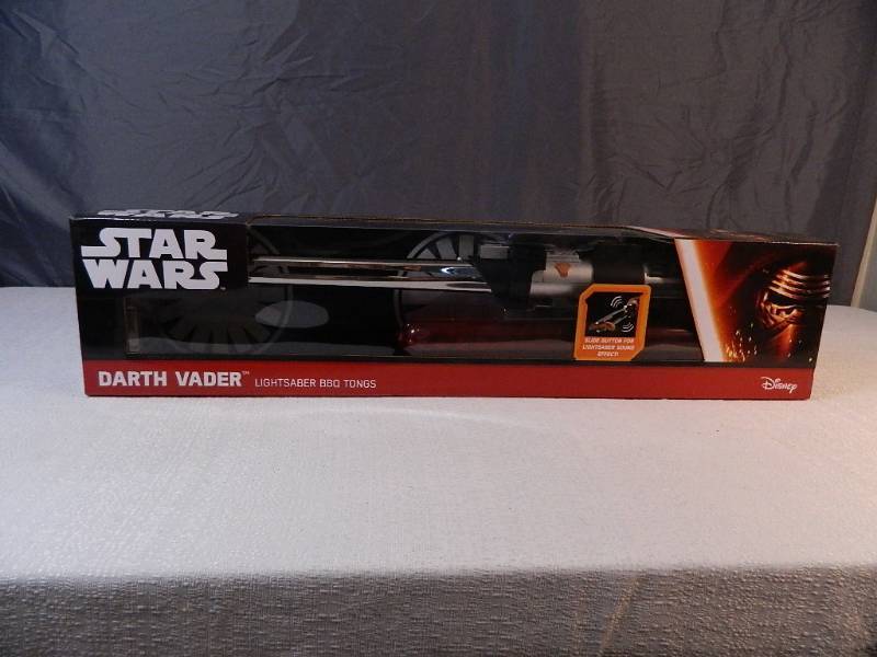 lot 27 image: New Star Wars Darth Vader Lightsaber BBQ Tongs