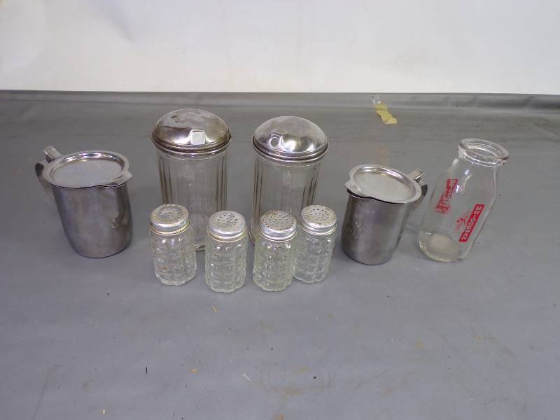 lot 64 image: Salt and Pepper Shakers, Sugar Dispensers, SS Cream Servers and small Milk bottle